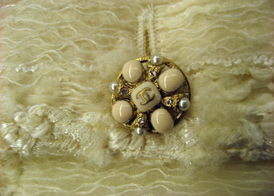 Detail of the button on the ivory lesage 06a suit
