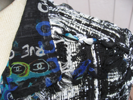 you can see the silk graffiti print lining in this closeup of the collar of the 07c Lesage