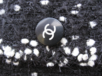 detail of the button on the pocket of the 95a Snowflake jacket