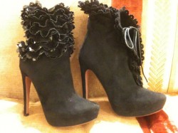 Alaia black boots with ruffles