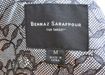 Behnaz' trench is fashionably lined in lace
