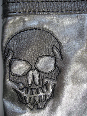 detail of a skull on the reverse of the Great China Wall bag