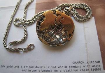 Reverse of Sharon Khazzam World Pendant with rubies in Florida and Japan